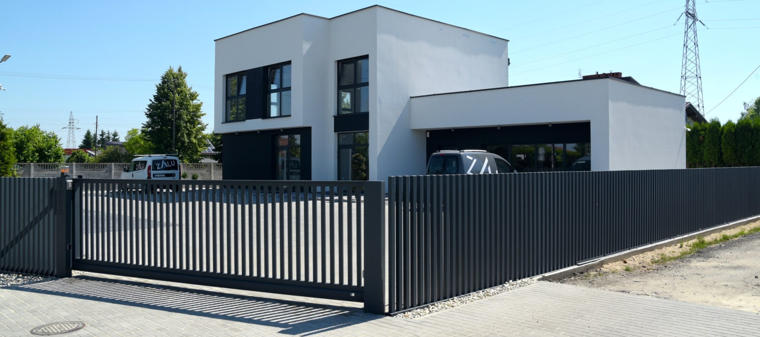 A white house covered with fencing - Fencing Contractors